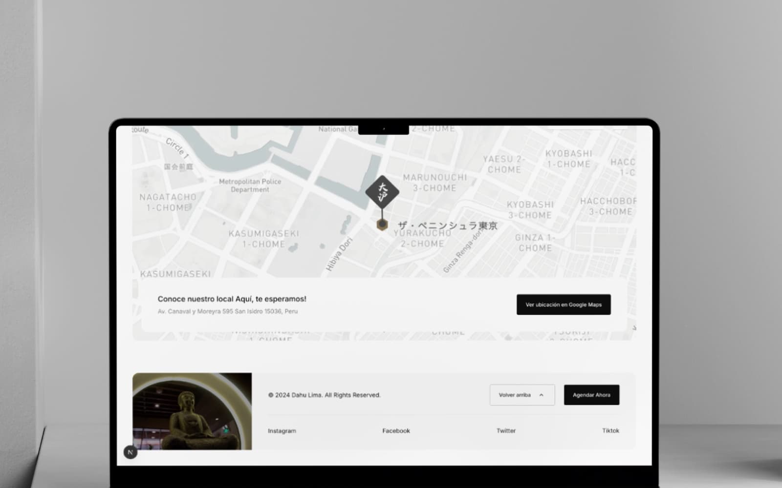 DAHU Spa — map and footer on a laptop