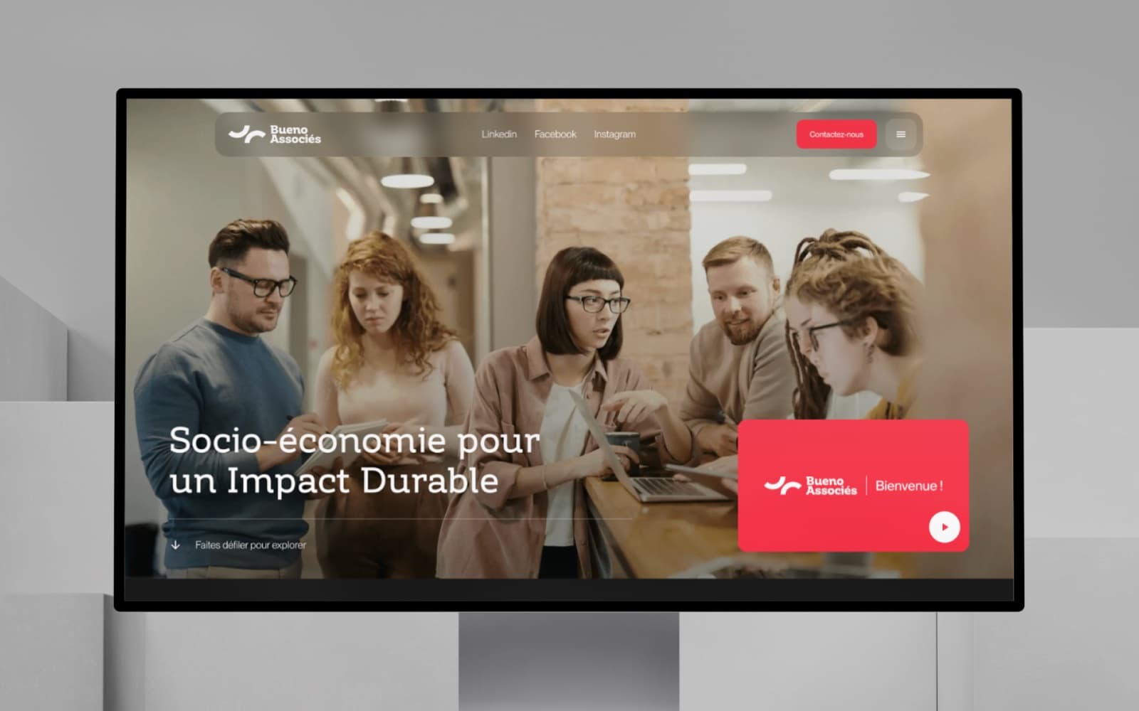 Bueno Associés — home page in a monitor mockup